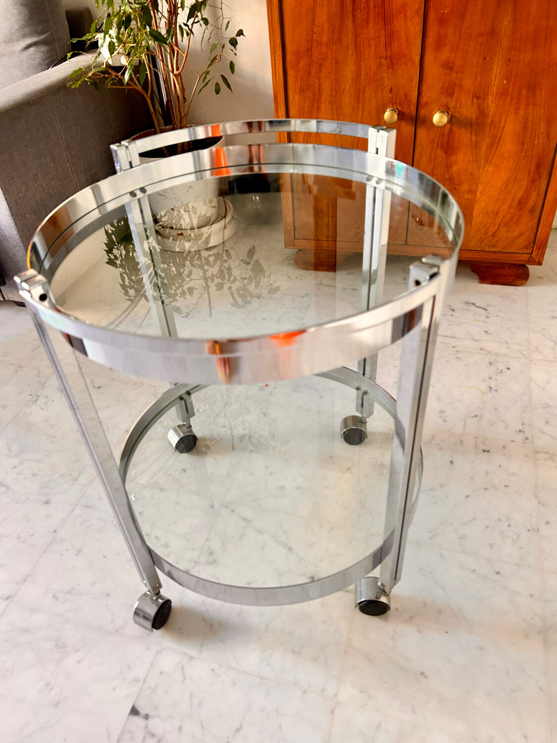 Vintage round dessert trolley in chrome steel, with two glass shelves.
