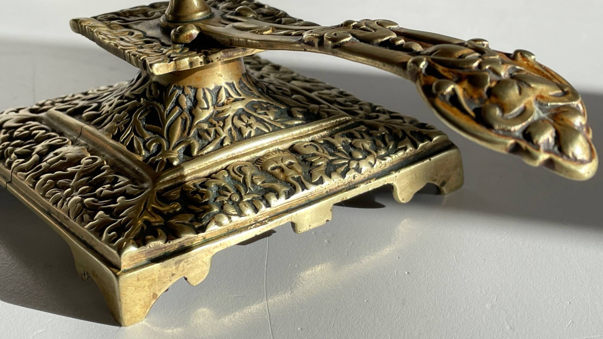 Patterned solid bronze hand candle holder