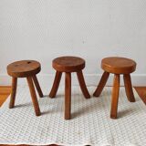 3 wooden tripod stools
