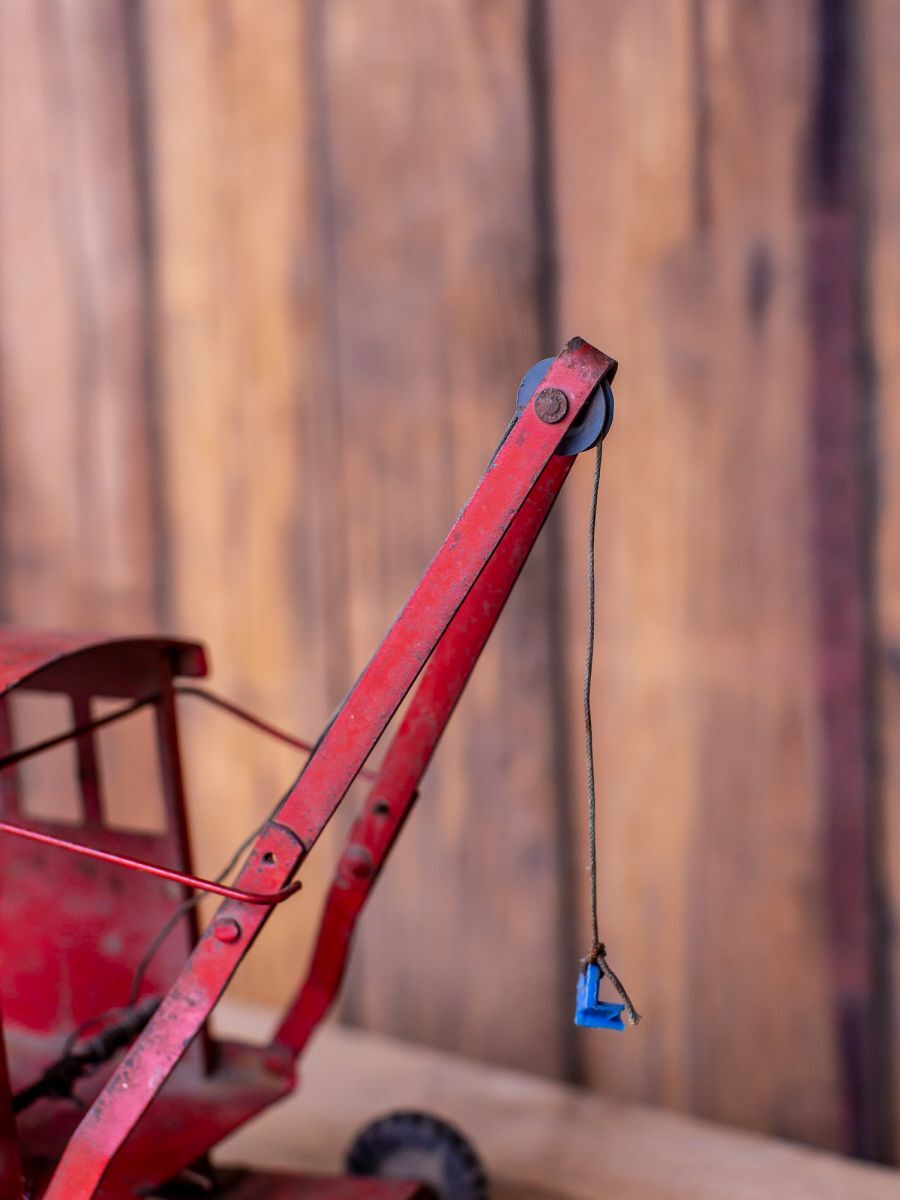 Old toy truck crane in sheet metal