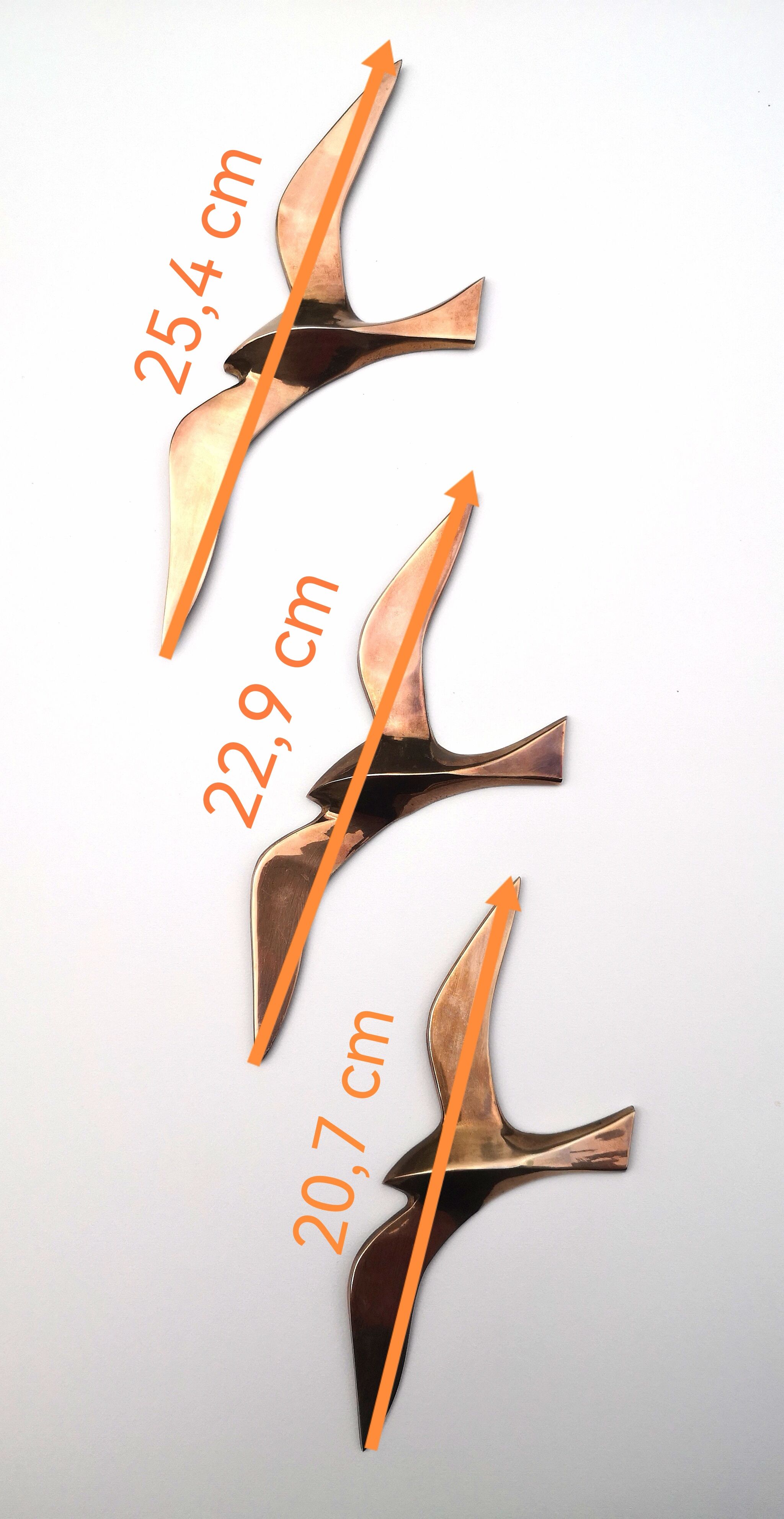 Birds stylized in brass