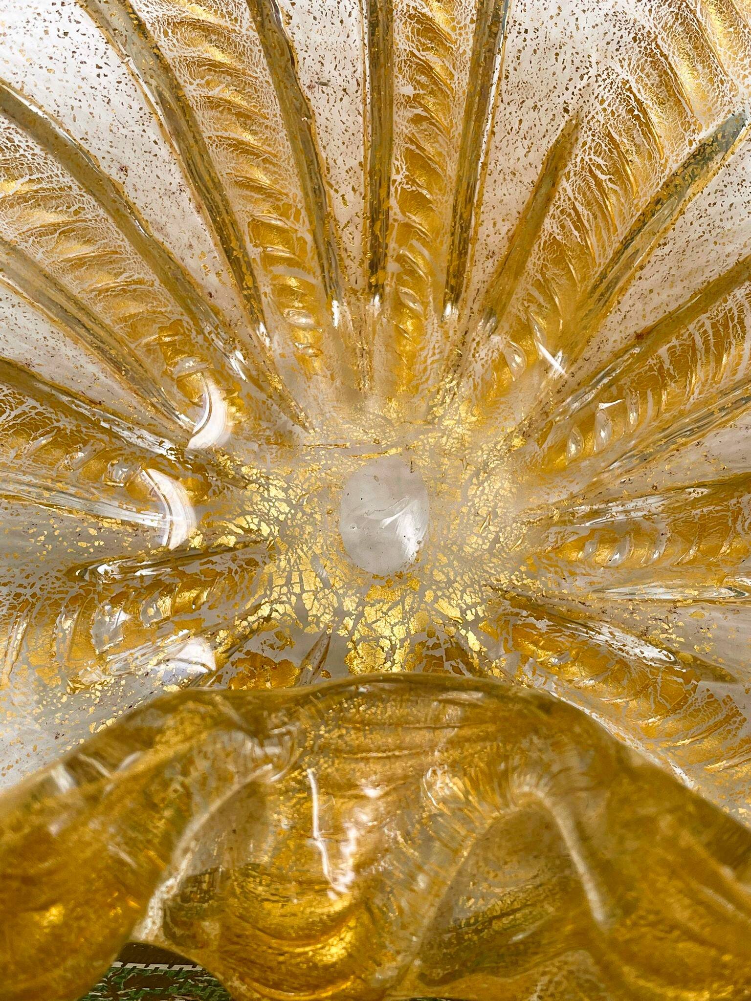 Murano glass scallop bowl in Italy with gold glitter trim