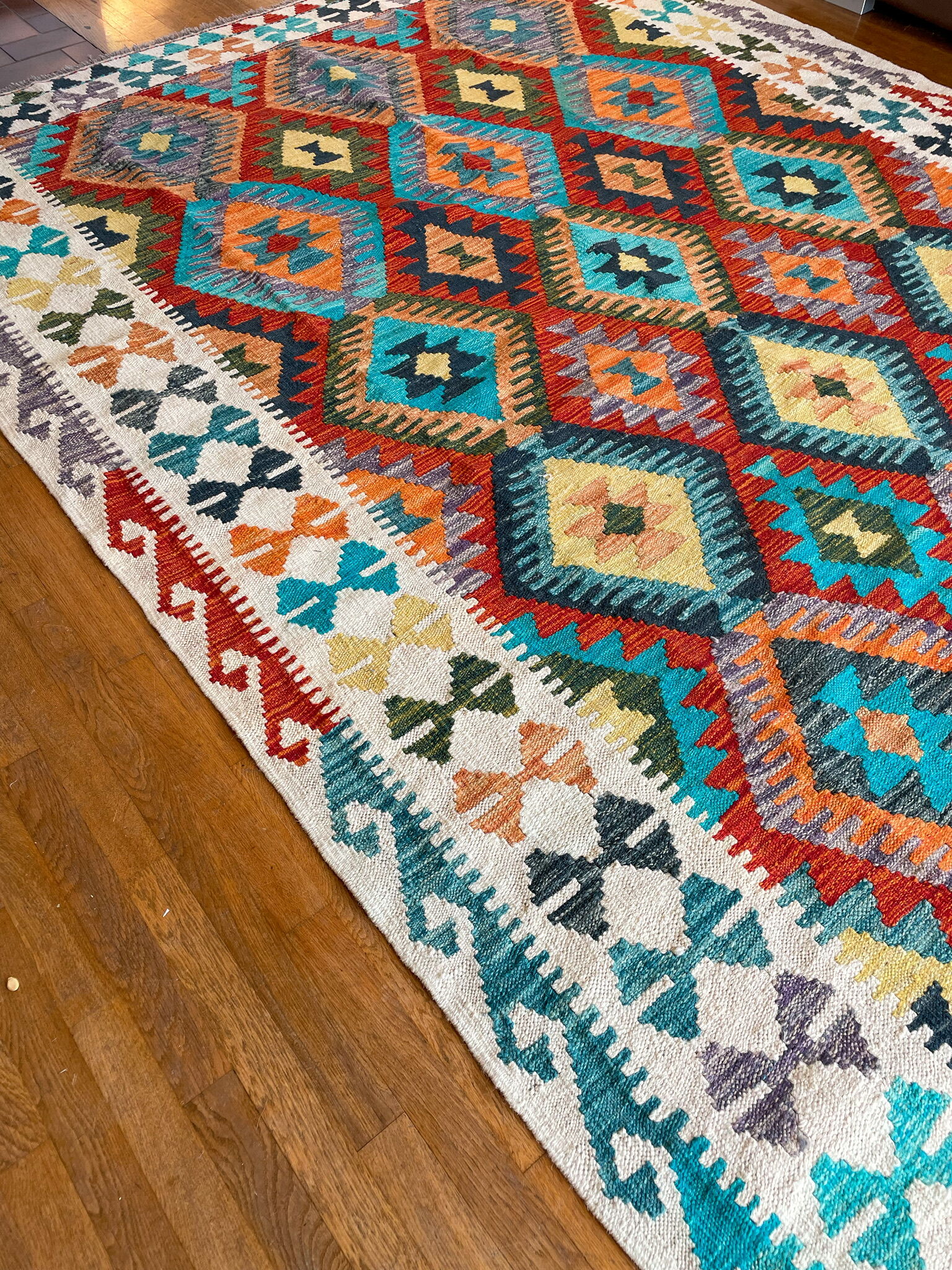 Oriental kilim rug afghan colored red and multicolored