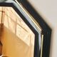 Octagonal mirror in lacquered black wood and brass - mirror smoked glass pink gold