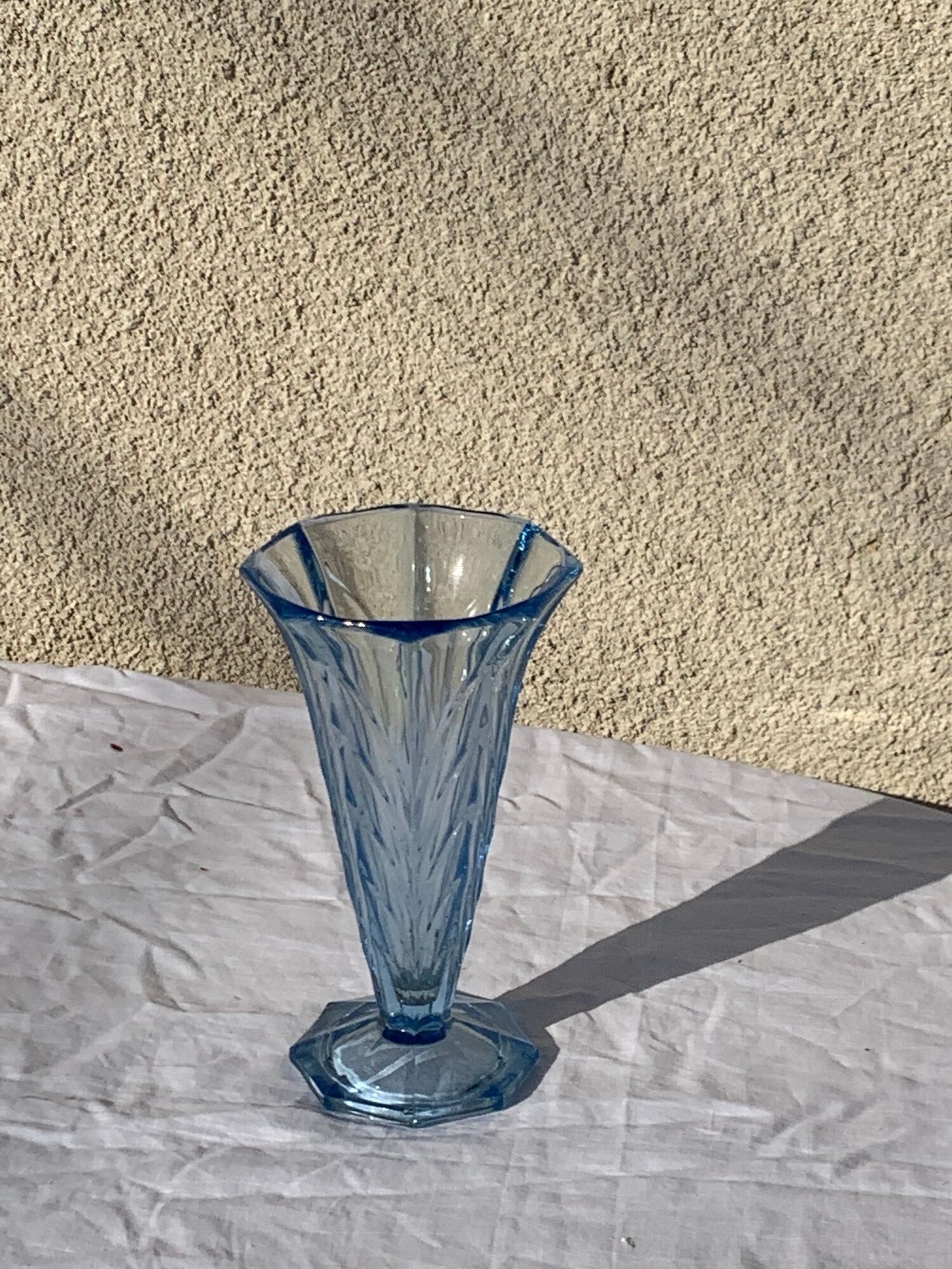 Blue molded glass vase in art deco relief