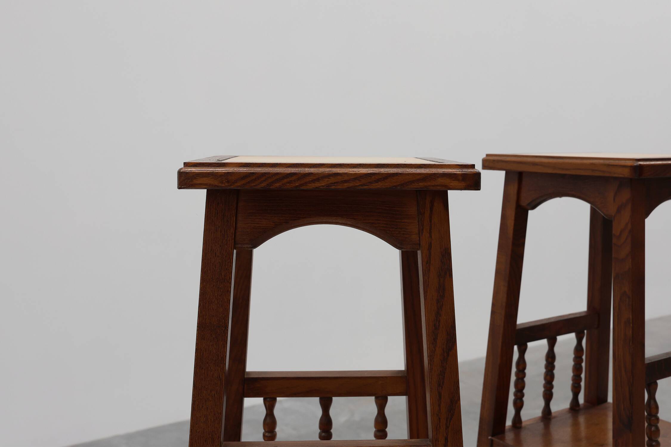 Pair of 20th century rustic wooden side tables with ceramic tile top