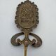 Brass coat rack with floral decoration