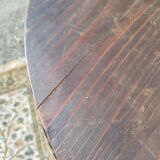 Small rustic antique tripod side table made of solid wood.