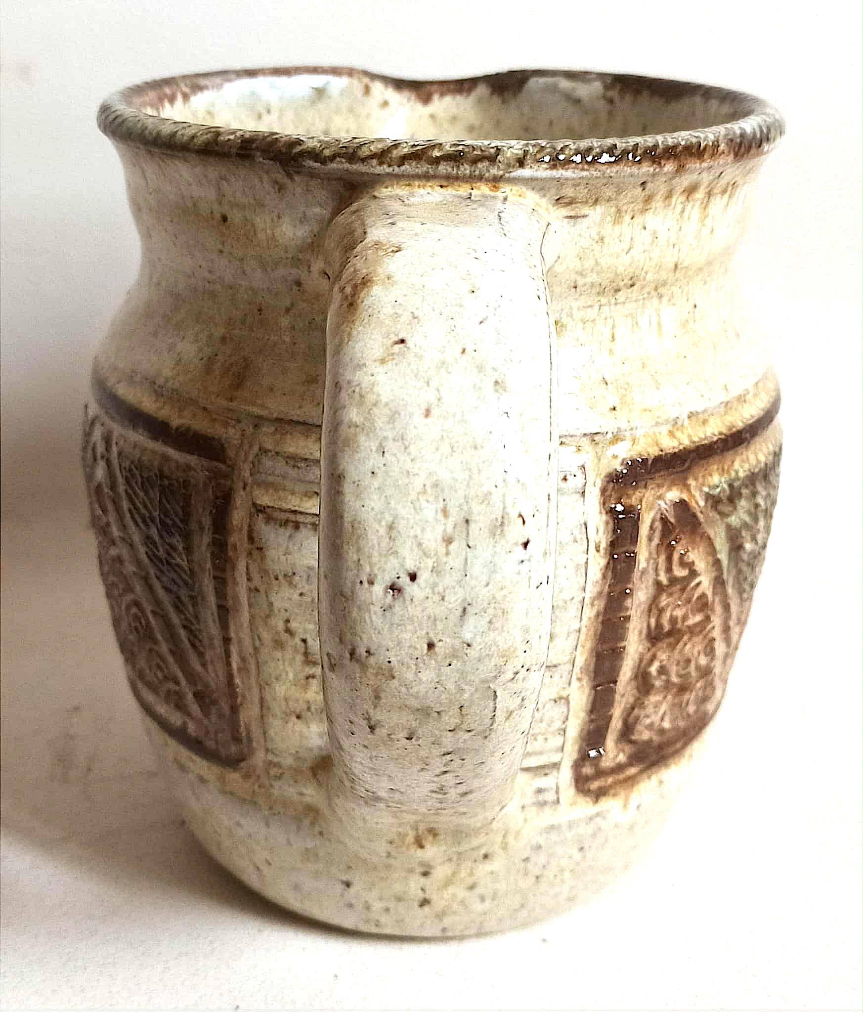 Stoneware pitcher stamped Giraud. Height 18.5 cm