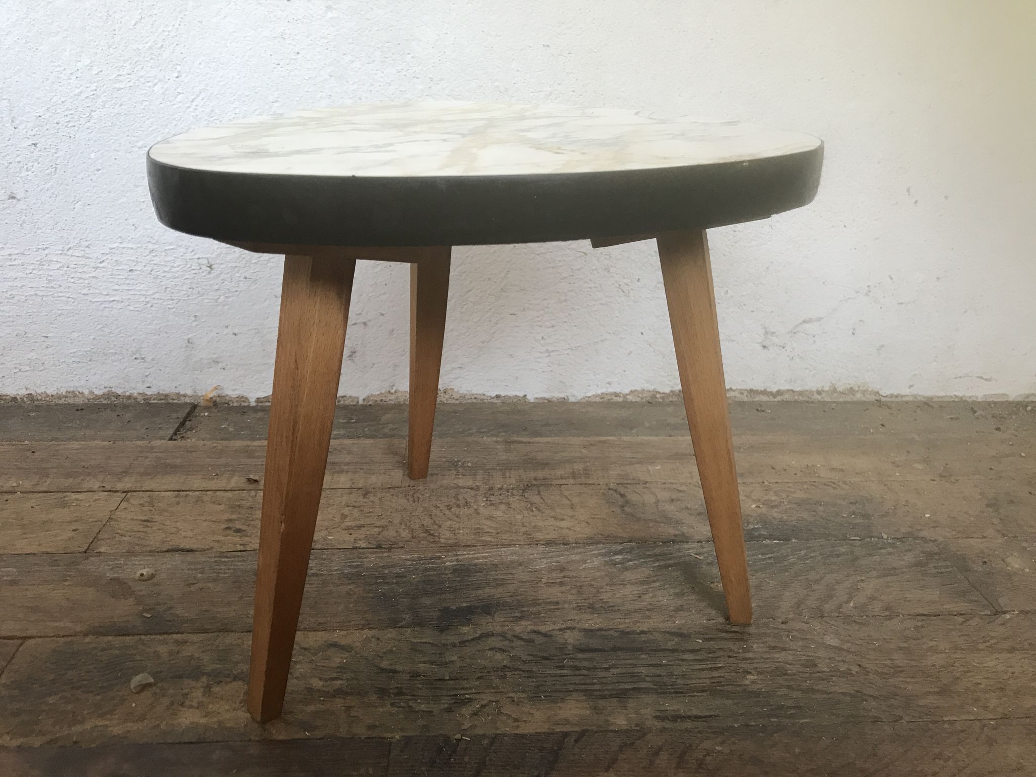 Small triangular table coffee table with a vintage tripod door midcentury plant 1950