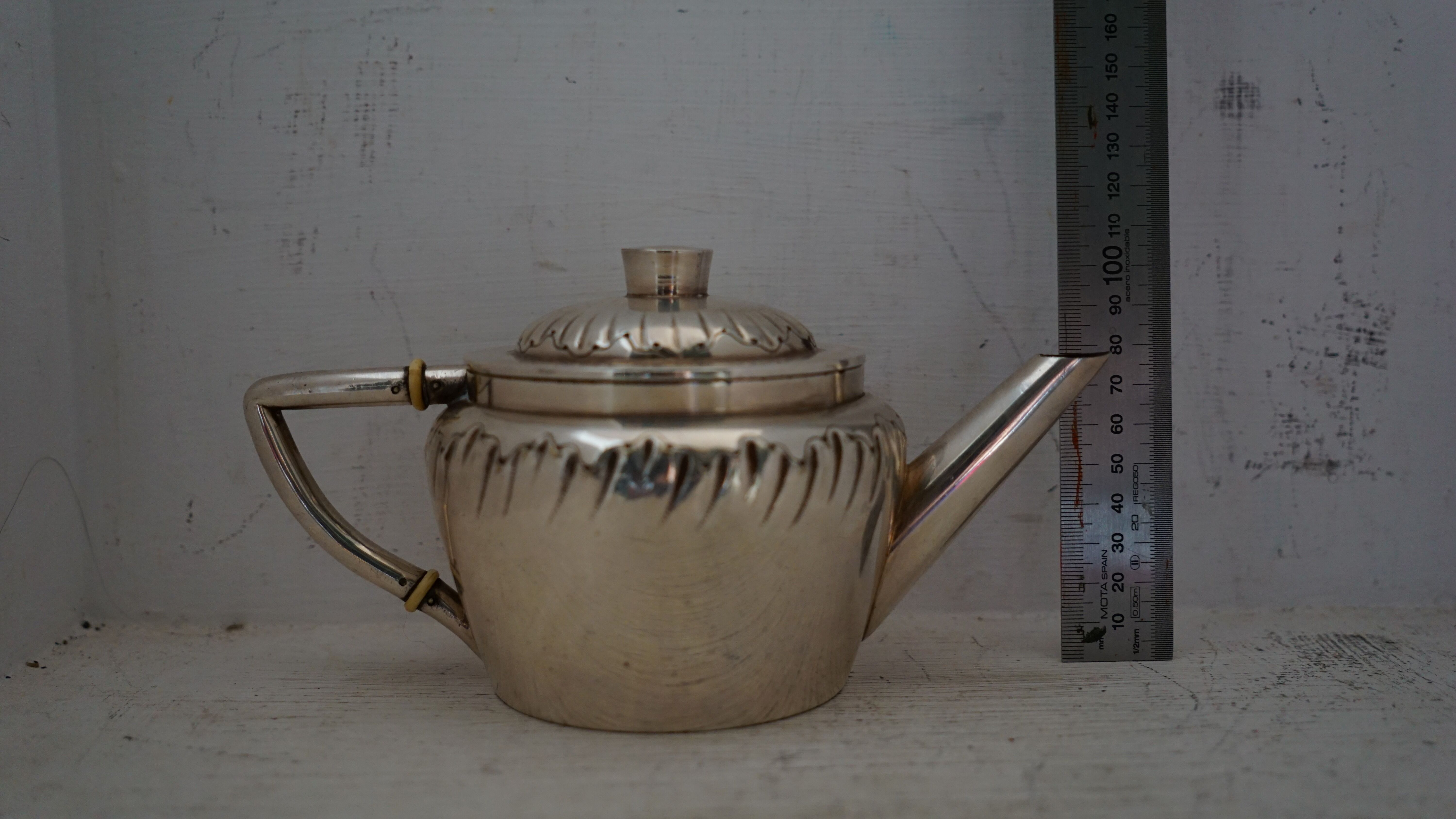 Teapot and milk jug English silverware