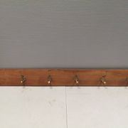 Coat rack in teak and brass. Denmark 1970-80s