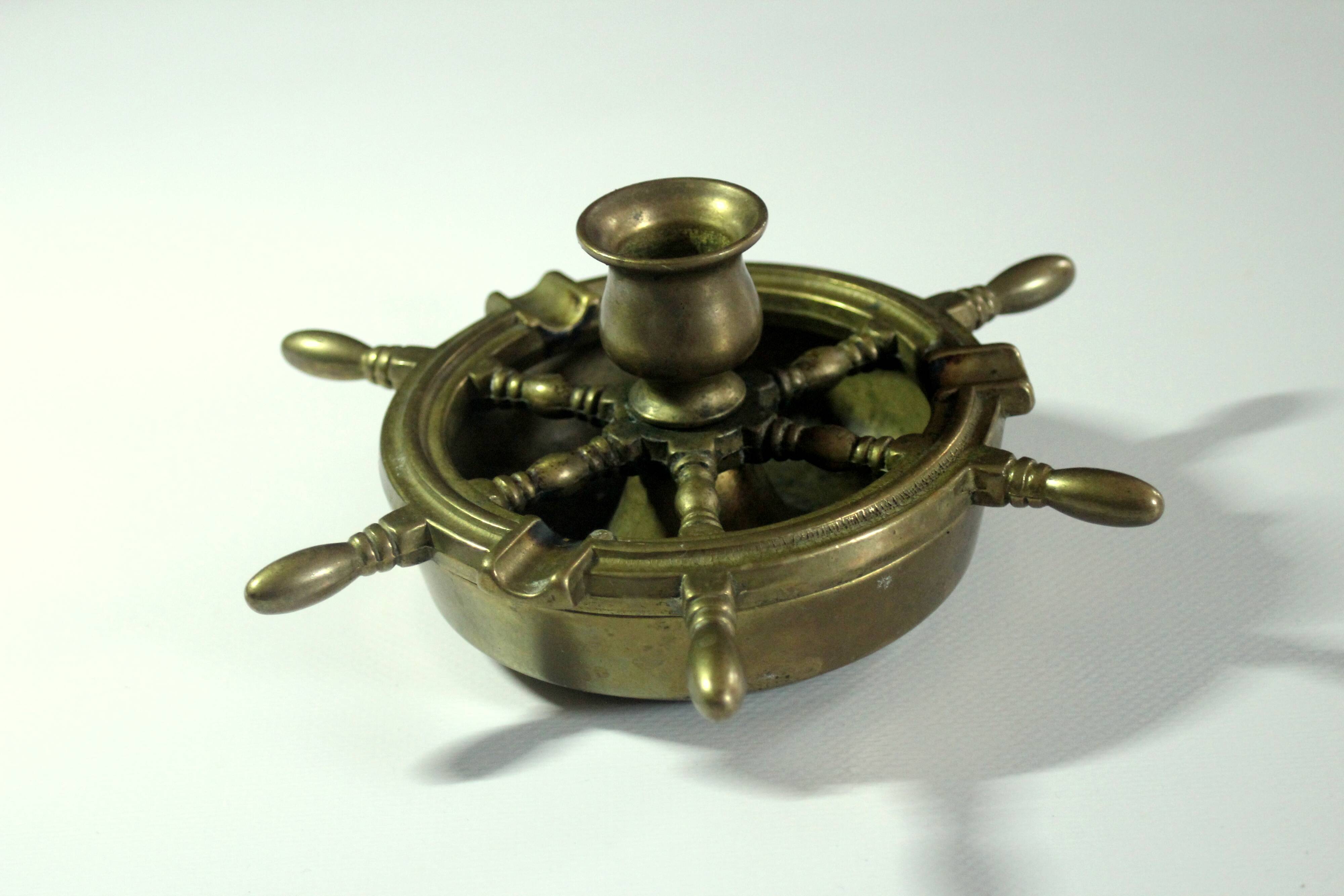 1960s solid brass ashtray in the shape of a steering wheel with a candle stick, vintage