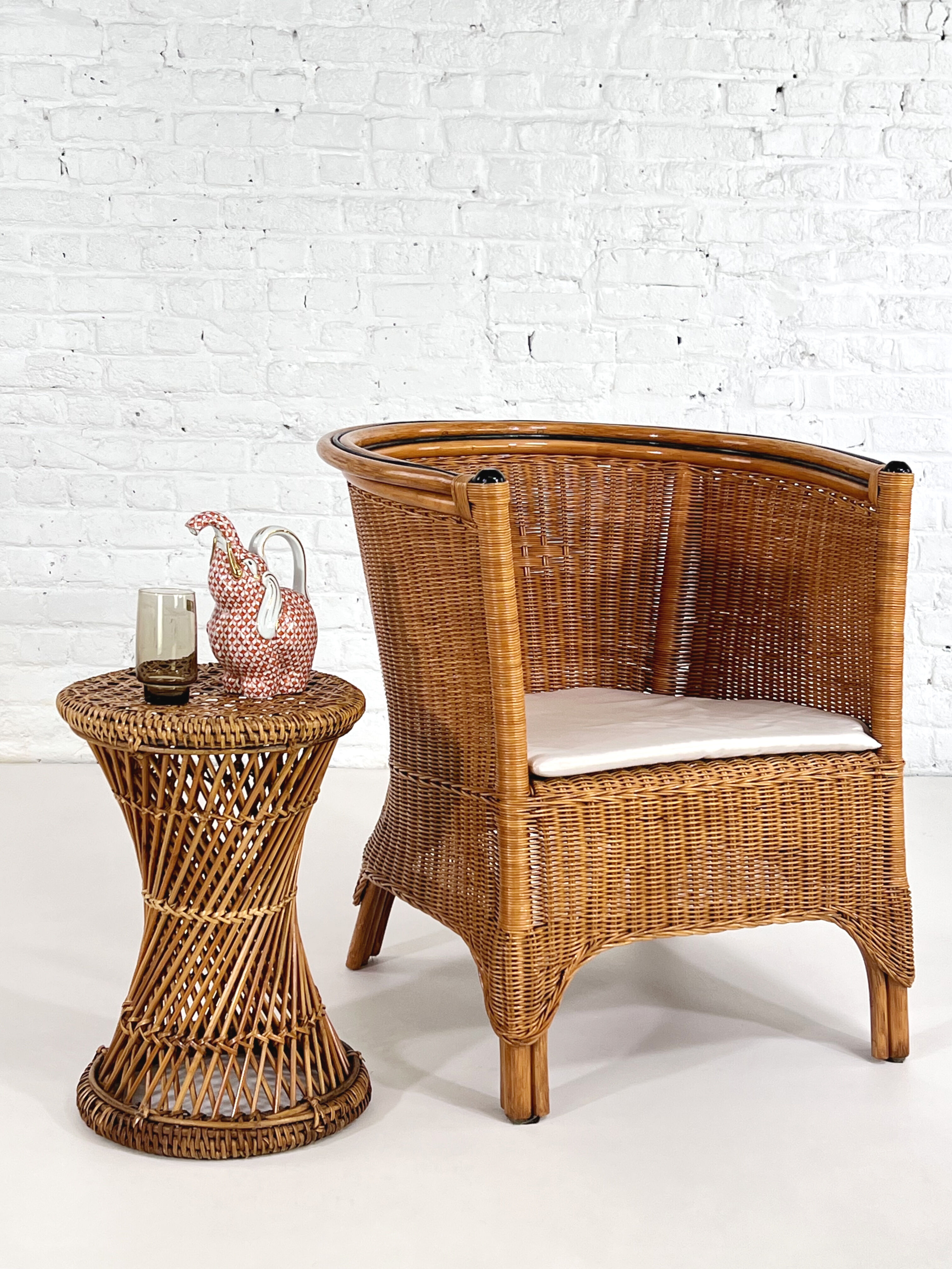 Pair of cabriolet armchairs in wicker and black edging