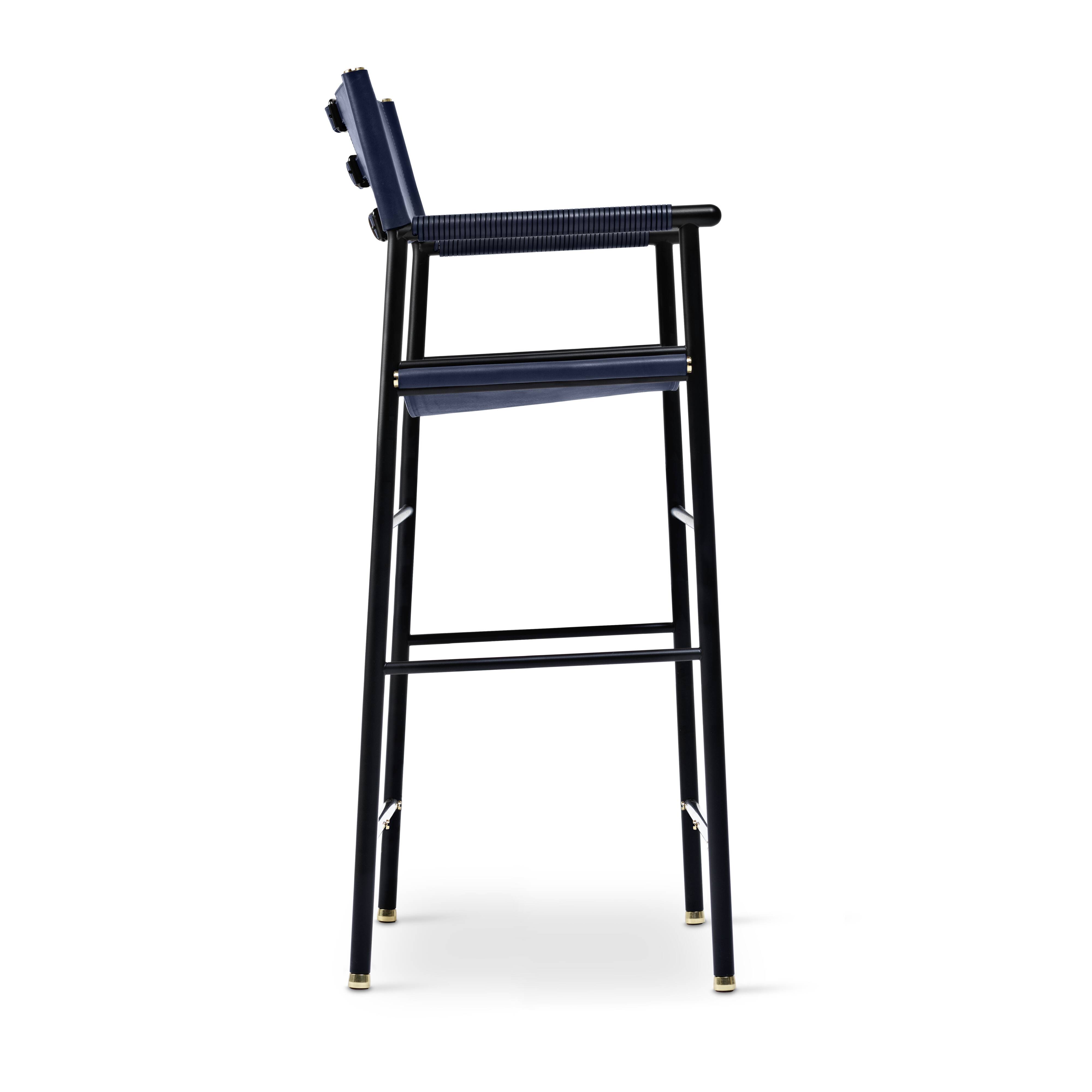 A pair of bar stools with a navy blue leather backrest and black rubber.