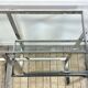 Chrome metal and glass console from the 2000s.