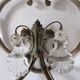 Pair of sconces in patinated metal and crystal tassels