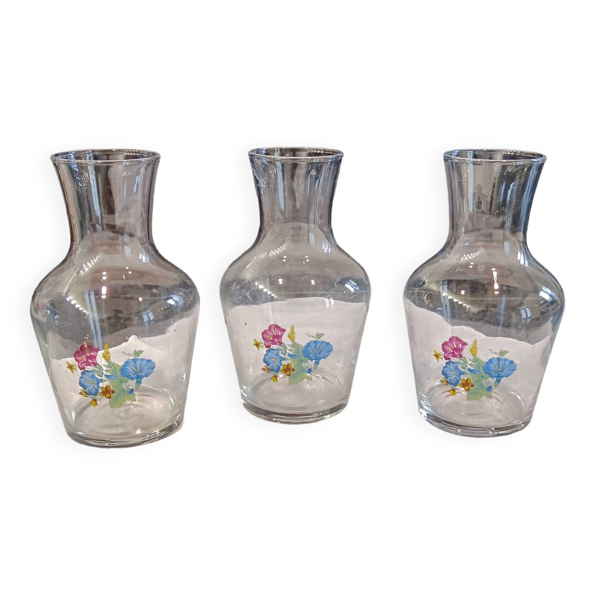 3 glass carafes, vintage. Very pretty floral pattern.