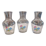3 glass carafes, vintage. Very pretty floral pattern.