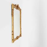 Miroir mural en bois sculpté et doré, très décoré, Belgique vers 1950