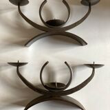 Pair of modernist candlesticks in beaten iron 1970