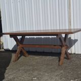 Dining table half a century with crossed legs