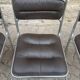 Four vintage chairs from the 1960s and 1970s, chrome with faux leather.