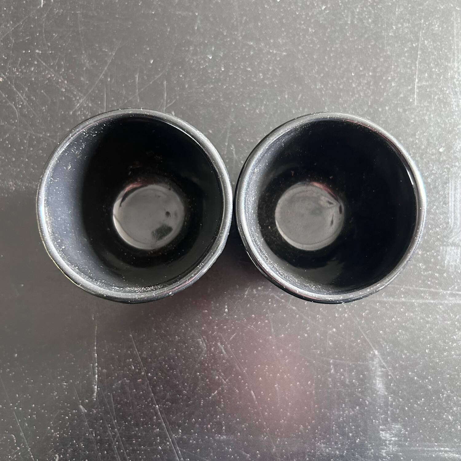 2 cast iron tea cups