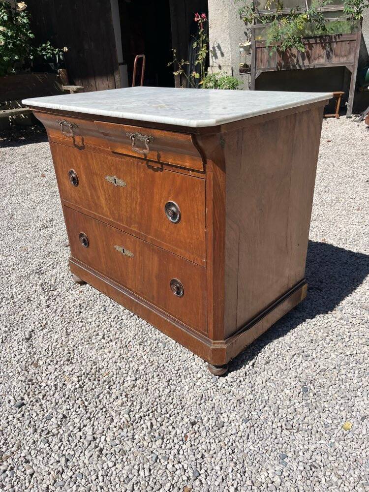 Commode with a white marble top