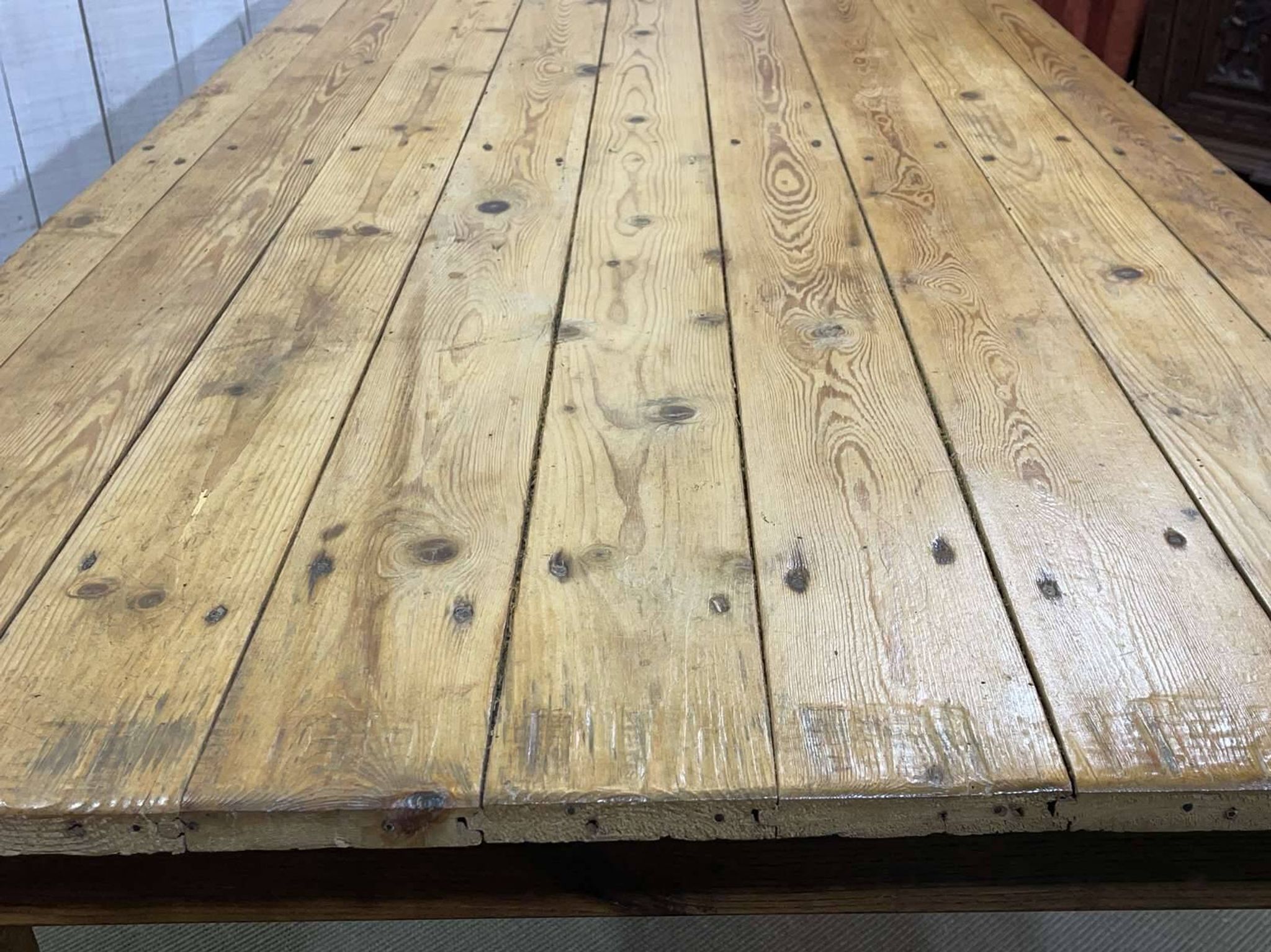 Early 20th-century farmhouse table made of fir, elm, and chestnut.