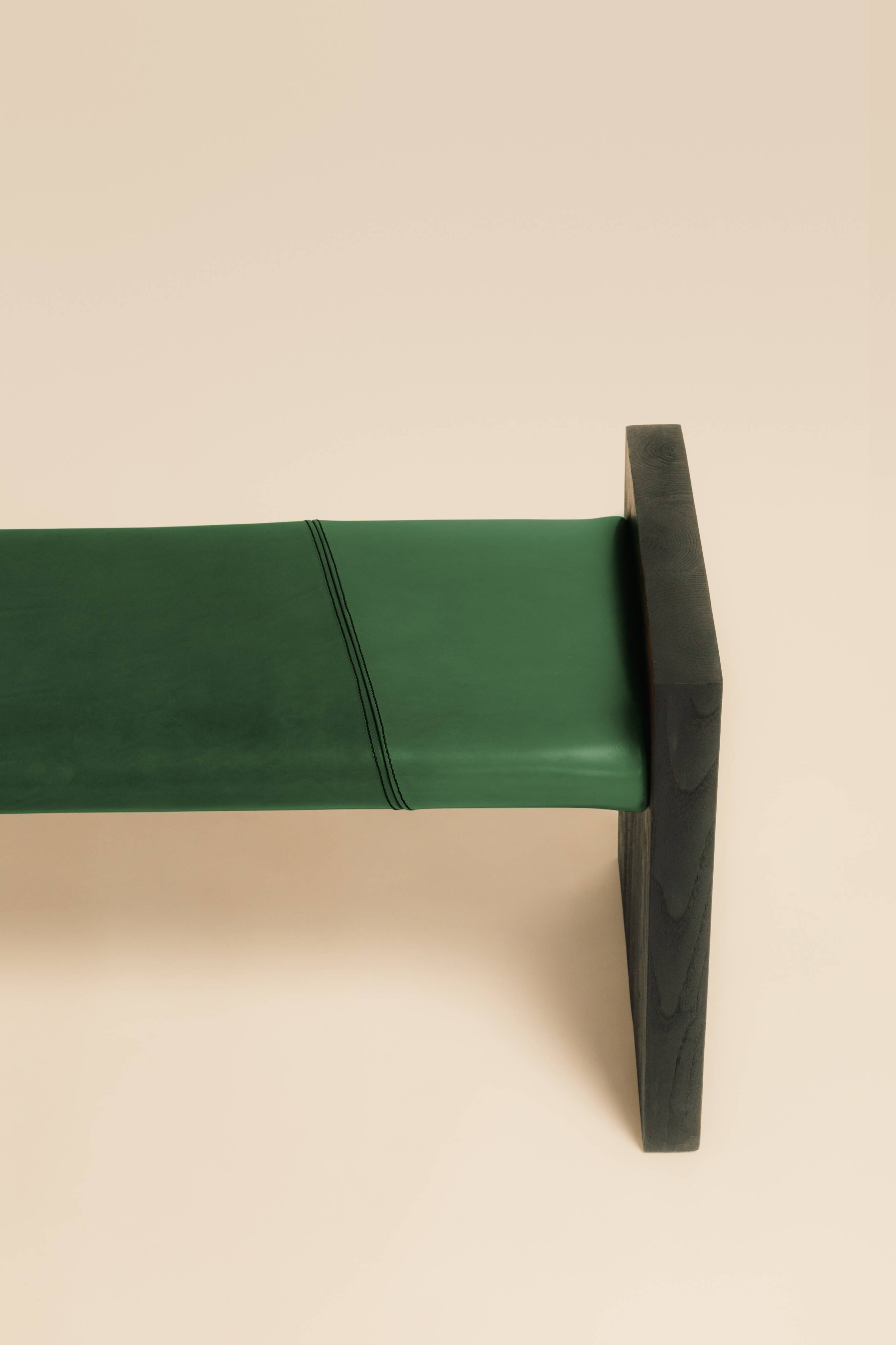Maërl bench, sepia model, ebonized chestnut and green leather