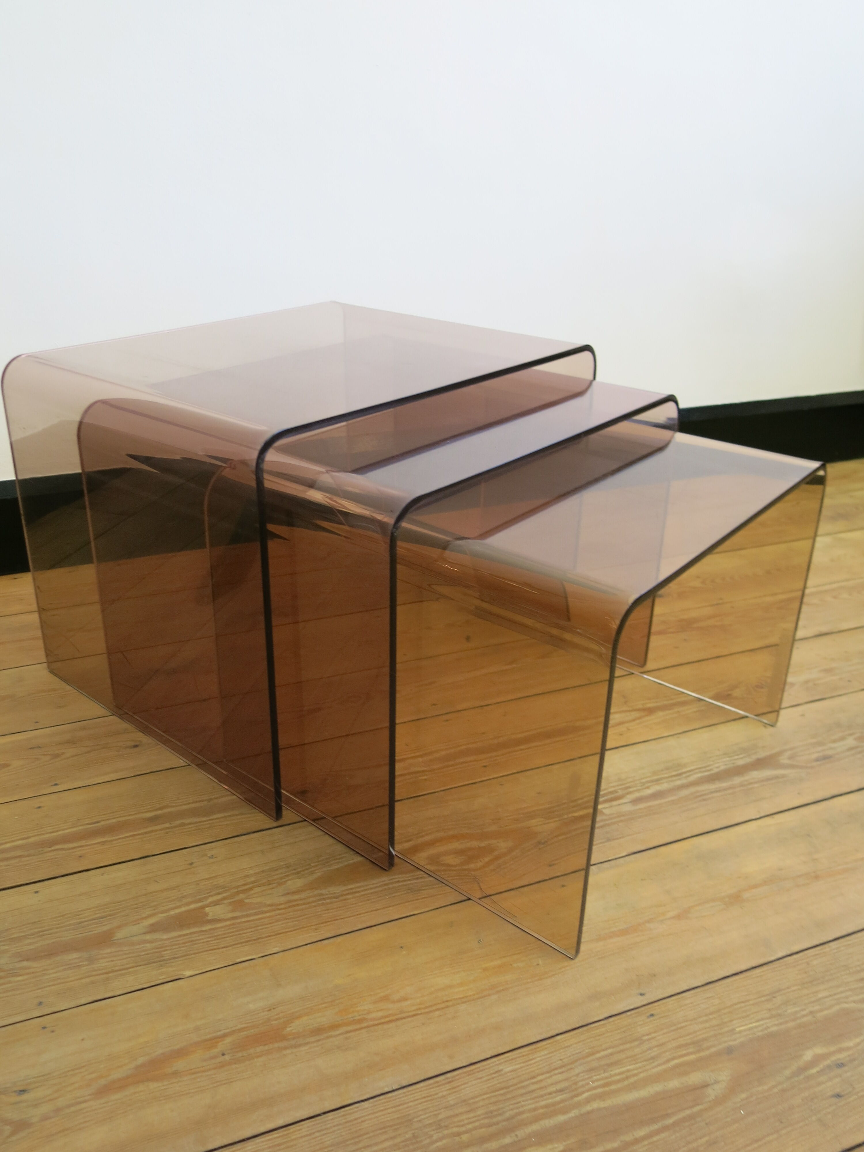 Plexi nesting tables by Michel Dumas