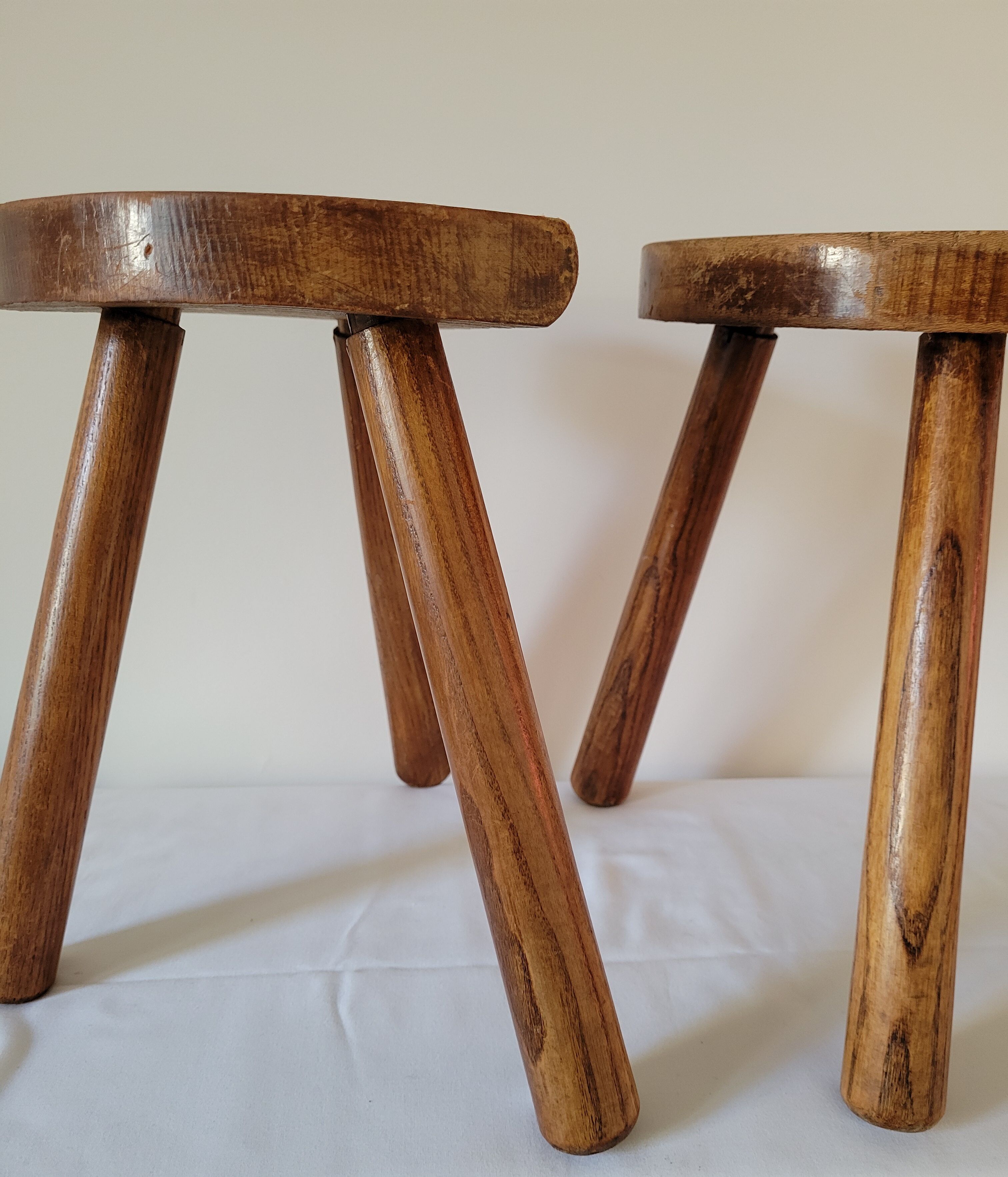 Pair of half-moon tripod stools