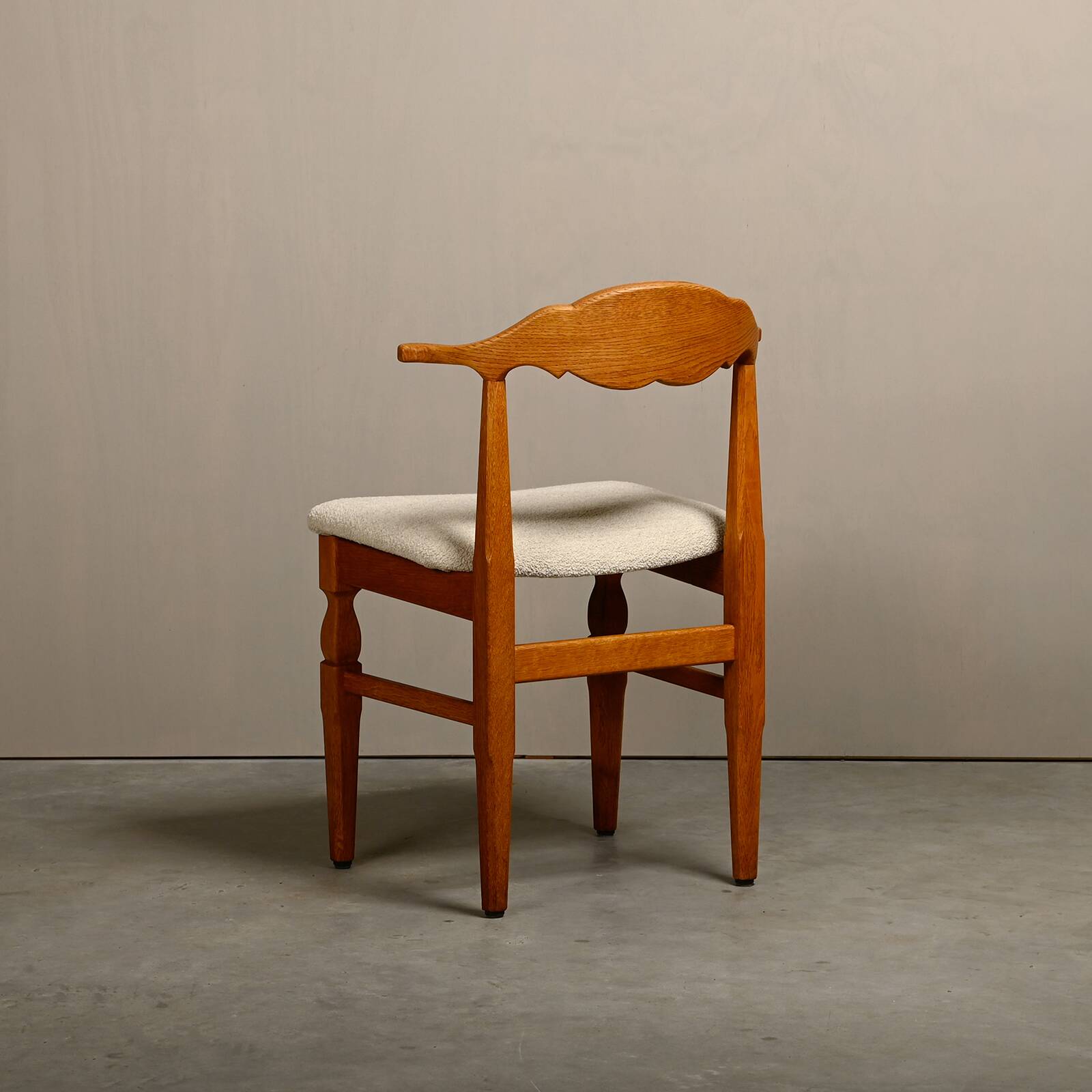 Henning Kjærnulf dining chairs set in Oak and Off White Bouclé, Denmark, 1960s