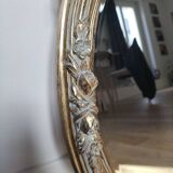 Miroir ovale doré style Louis XVI