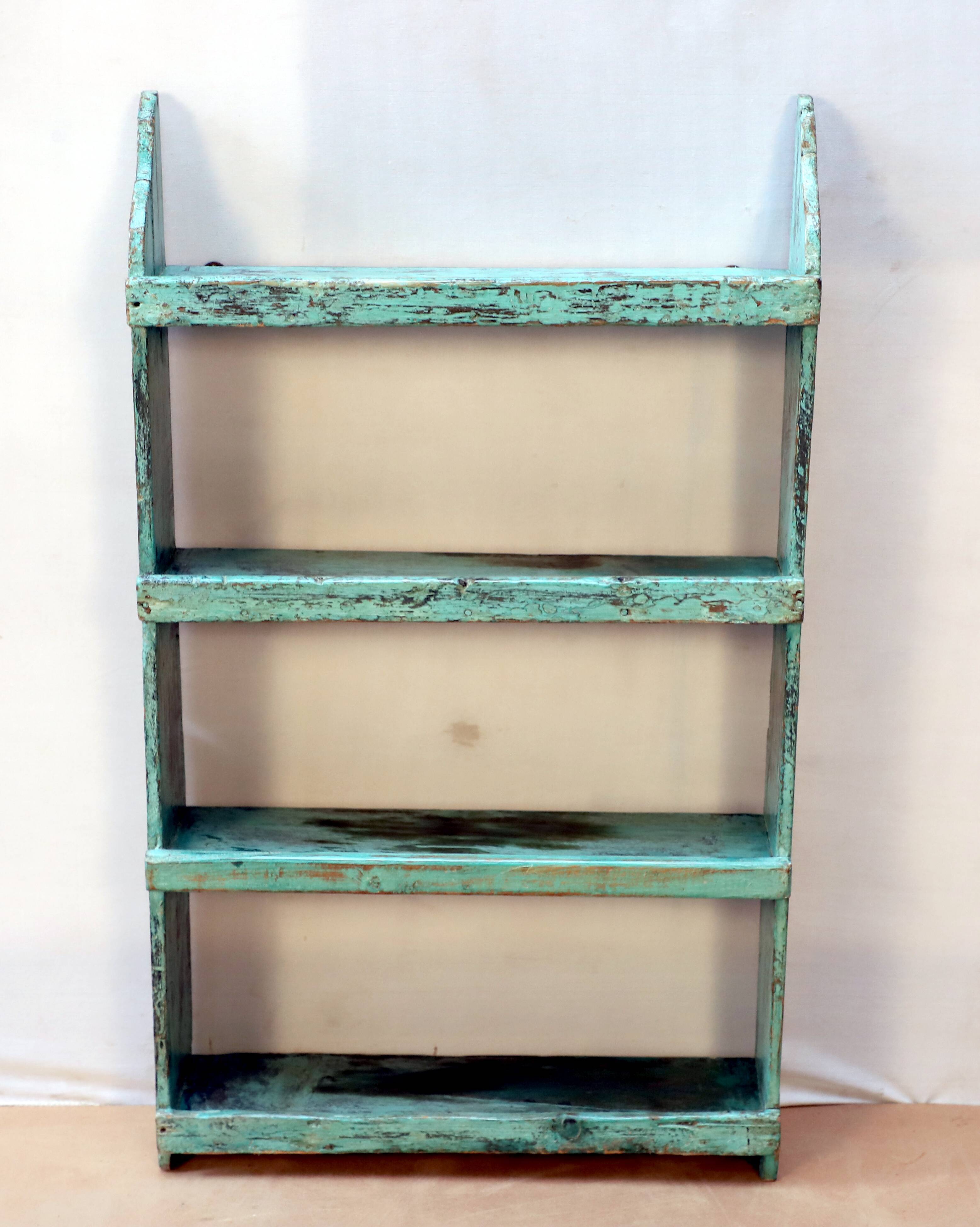 Burmese teak wall shelf with original green patina