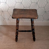 Brown turned wooden stool.