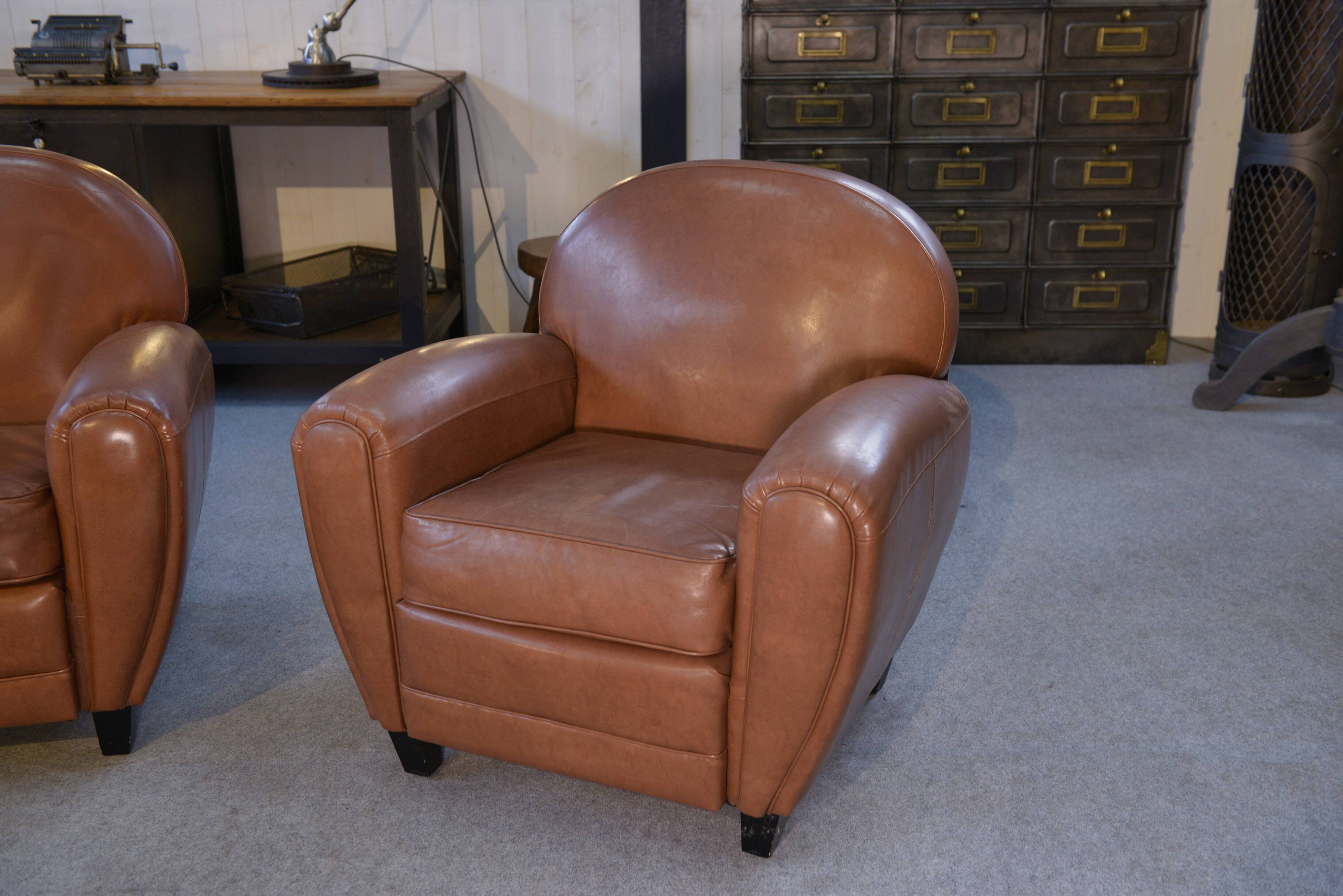 Ensemble 2 fauteuils club en simili cuir camel 1980’s