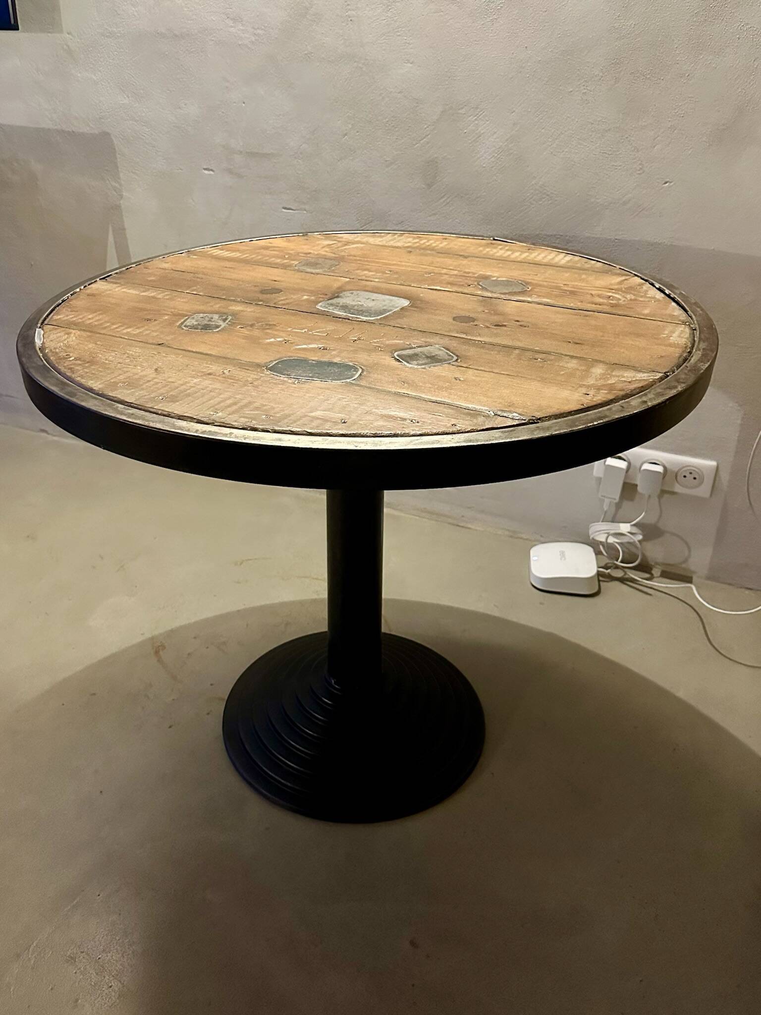 Old bistro round table / workshop – wooden top with metal rim – foot