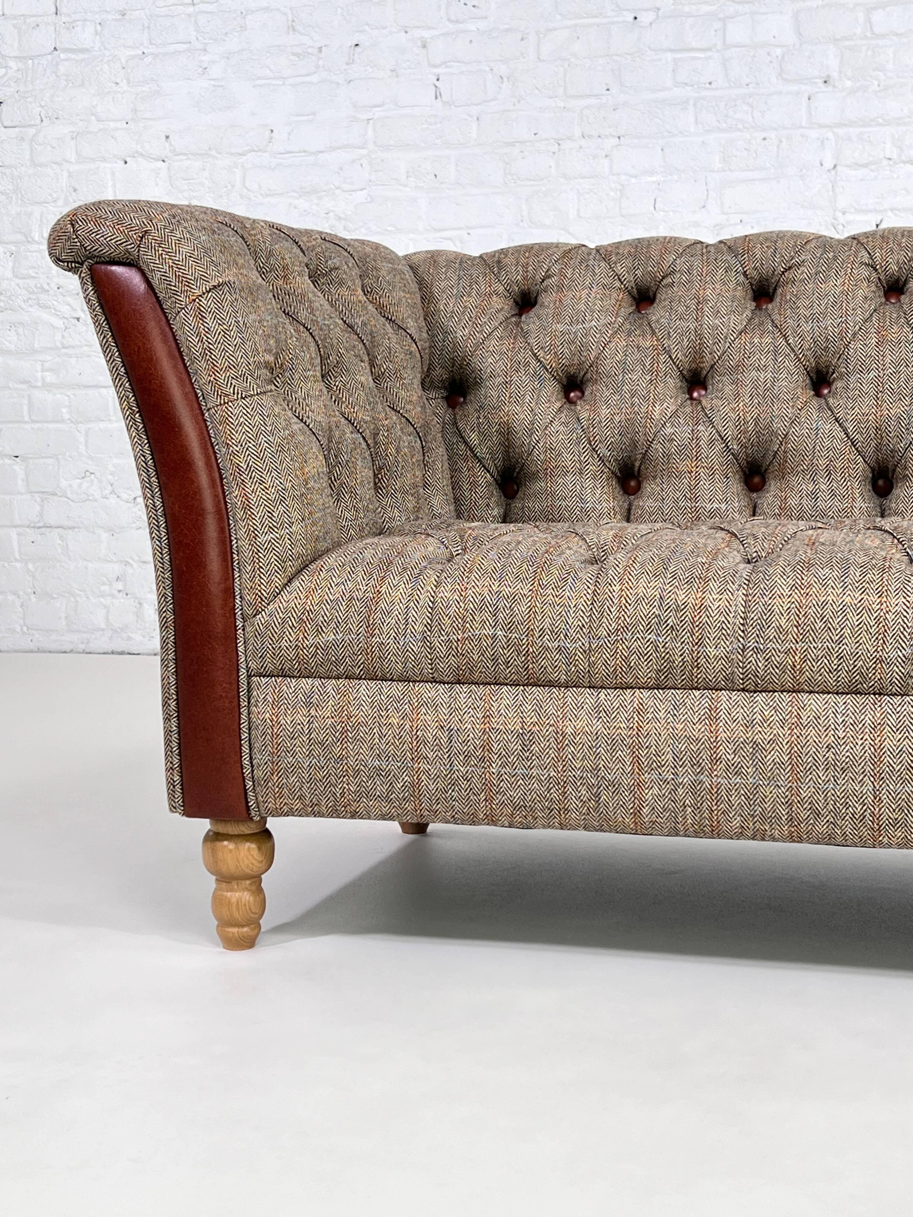 Chesterfield sofa in leather, fabric and wood