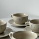 Ceramic cups and saucers with flower decoration