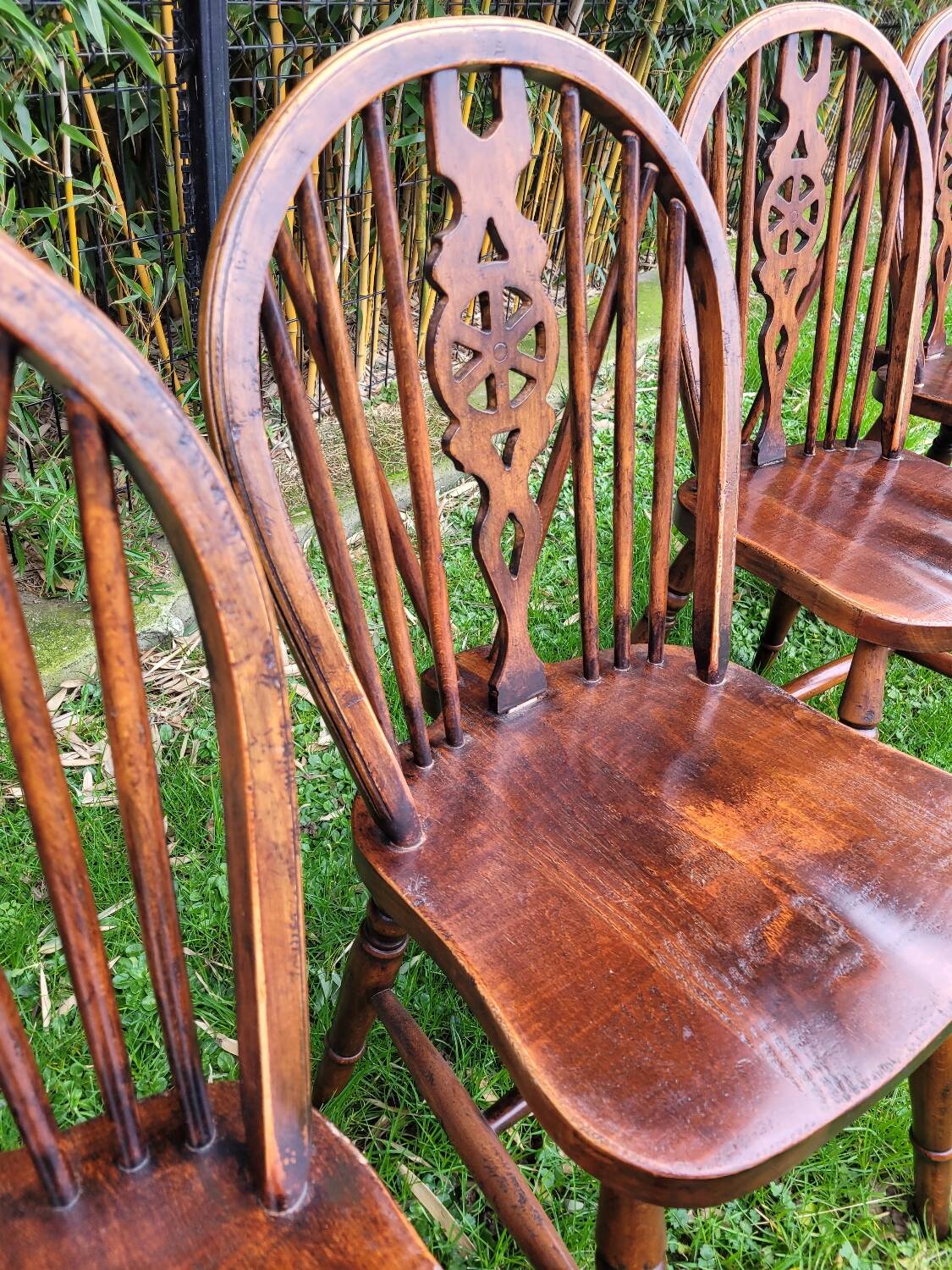 4 Windsor wheelback chairs in dark oak