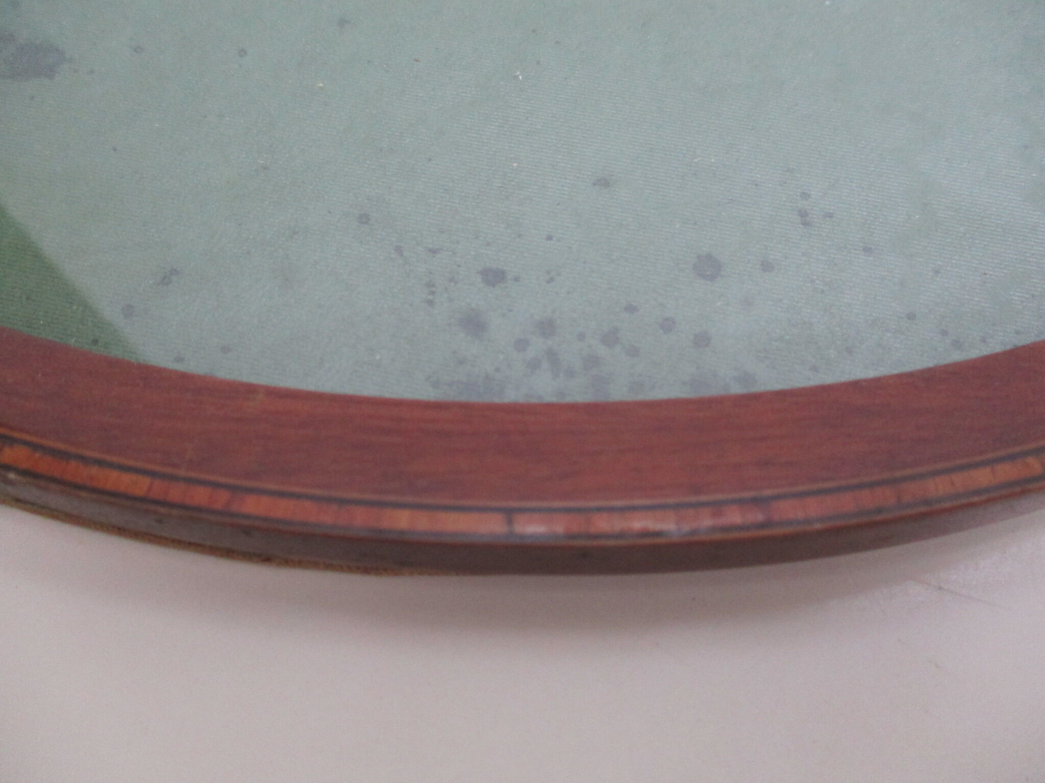 Oval wall frame in wood marquetry