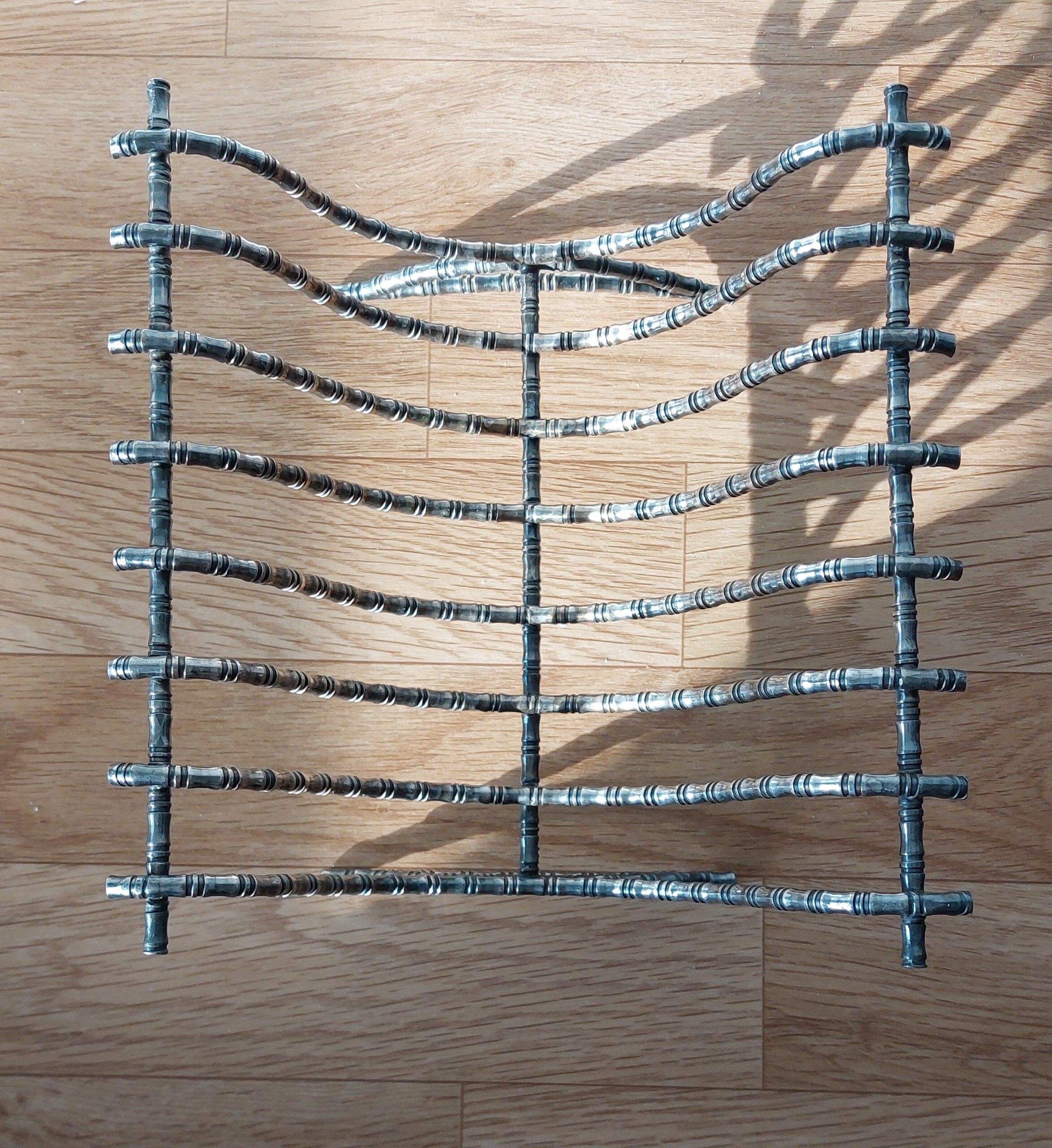 Silver metal cut in imitation of vintage bamboo.