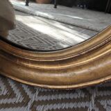 Antique oval gilded stucco mirror
