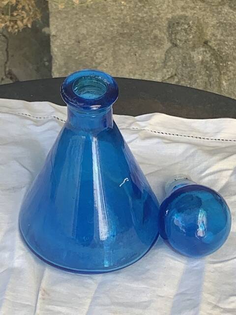 Blue bottle, glass vial for vintage perfume or liqueur.