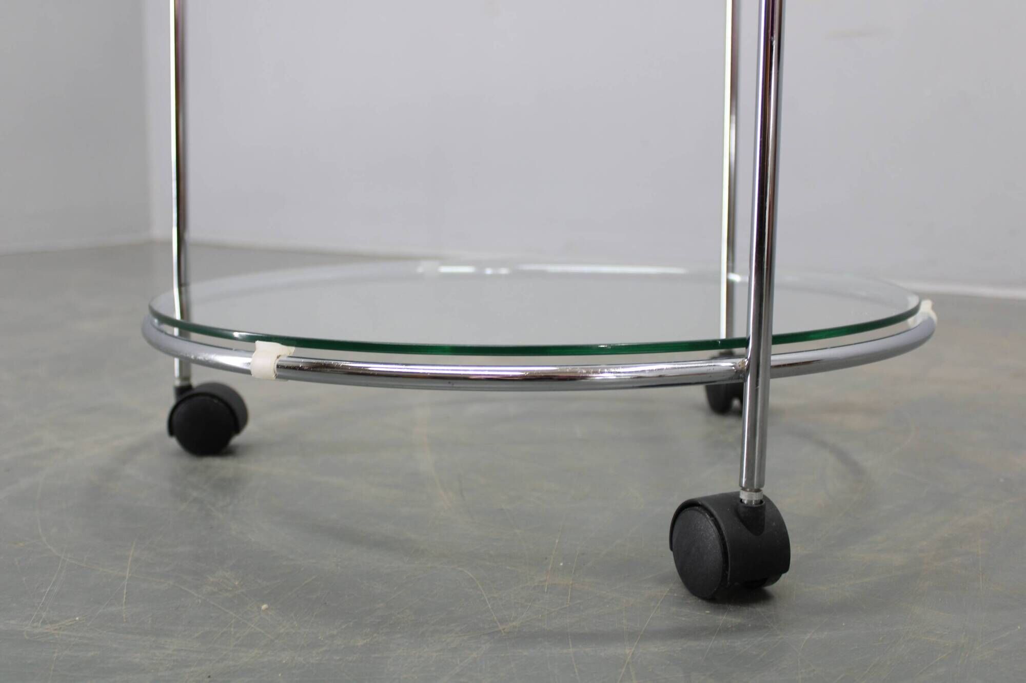 Mid-century round serving table, chrome and glass, Italy, 1980s