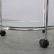 Mid-century round serving table, chrome and glass, Italy, 1980s
