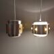 Two Space-Age hanging lamps, in silver-coloured aluminium with orange prisms.