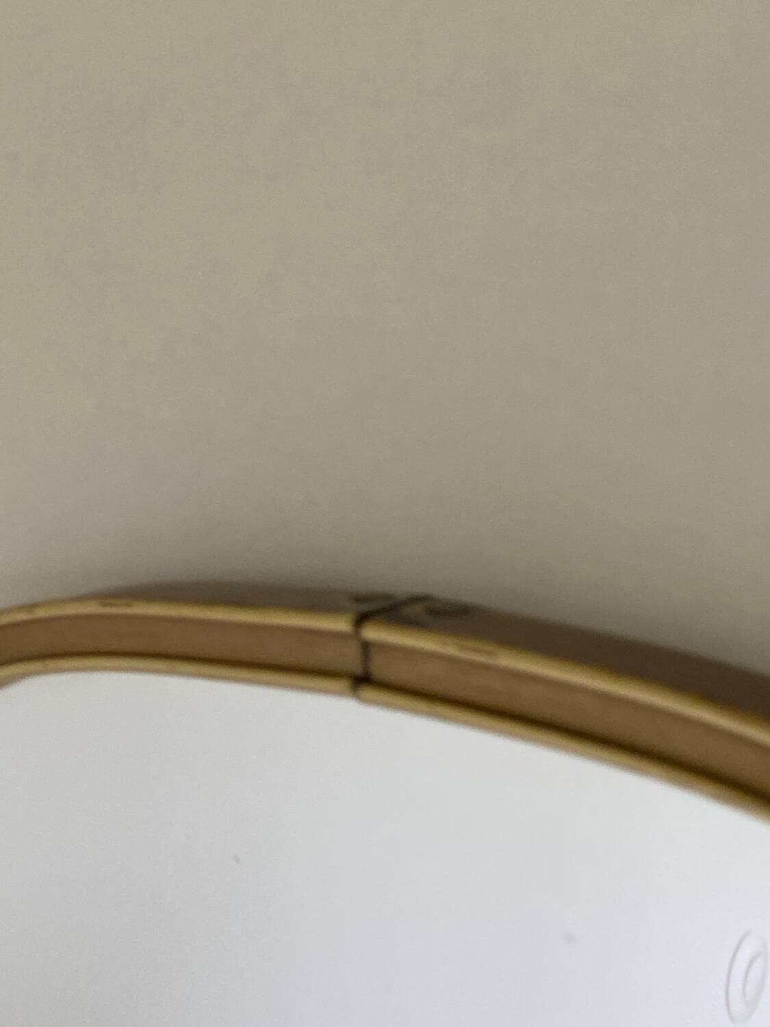 Vintage brass mirror in rear-view mirror shape